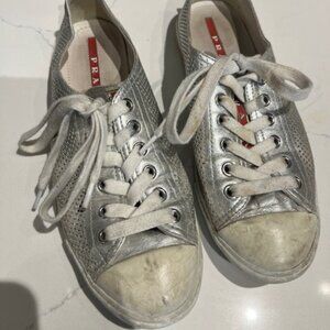 Silver gently worn Prada runners.